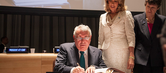 Minister Costello signing the Arms Trade Treaty in the presence of UN Under-Secretary General for Legal Affairs, Patricia O’Brien and High Representative for Disarmament Affairs, Angela Kane