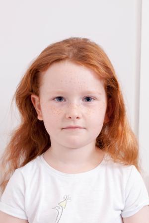 Example of Unacceptable Child Passport Photograph - Background