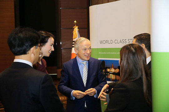 Minister Bruton chats with guests at the “Ireland & Korea: Partners in Education” event